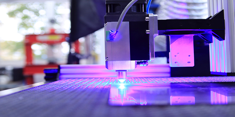 Image of a working laser cutter