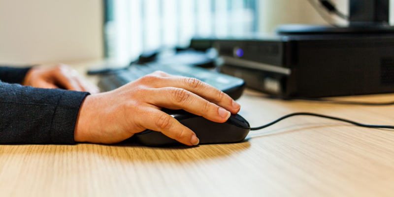 Image of someone using a computer mouse