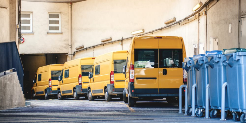 Image of vans parked by a building